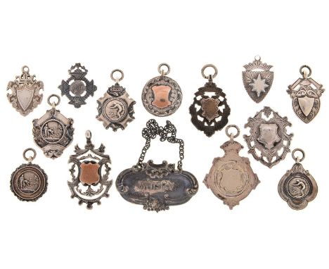 THIRTEEN SILVER AND SILVER AND GOLD WATCH FOB SHIELDS, LATE VICTORIAN-EARLY 20TH C, VARIOUS SIZES AND MAKERS AND AN ELIZABETH
