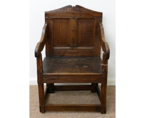 AN OAK PANEL BACK ARMCHAIR,&nbsp; ELEMENTS 18TH C AND ADAPTED, WITH TWIN PANEL BACK AND BOARDED SEAT ON CHAMFERED LEGS UNITED