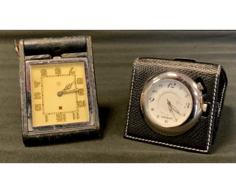 A Jaeger Le-Coultre Art deco desk/travel clock, off white dial, luminescent Arabic numerals, case numbered 013968, leather fo