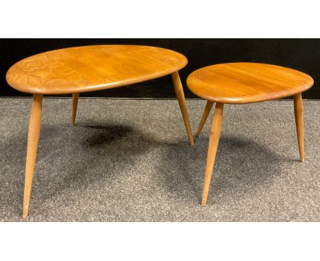 An Ercol ‘Pebble’ model nested pair of ‘Blonde’ Elm side tables, the largest measuring 39.5cm high x 65cm wide x 44cm, (2). 