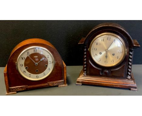 An early 20th century oak cased mantel clock, silvered brass dial, Arabic numerals, twin winding holes, 8-day chiming movemen