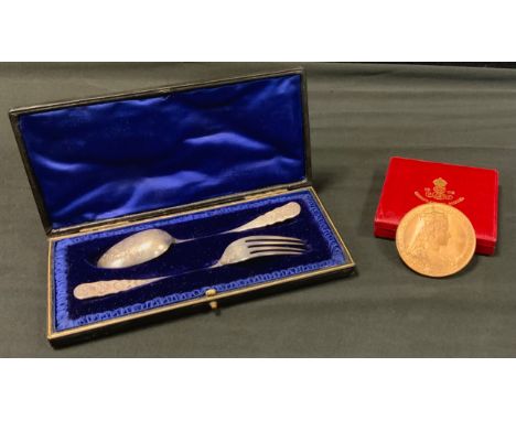 A cased christening set, fork and spoon, London 1904, 46g;  1902 Edward VII coronation medal, cased (2) 