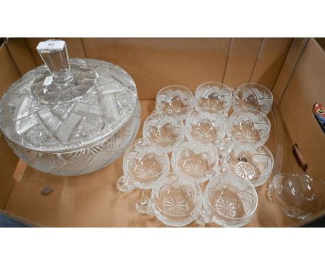 A cut glass punch-bowl and cover to/w eleven matching cups and a ladle 