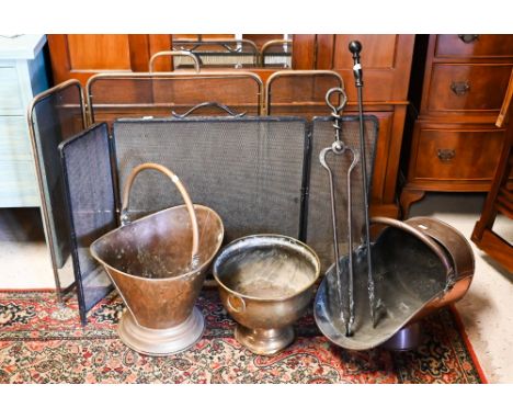 An antique copper coal scuttle to/with a brass coal bucket, a brass planter, two (differing) fire tools and two (differing) f