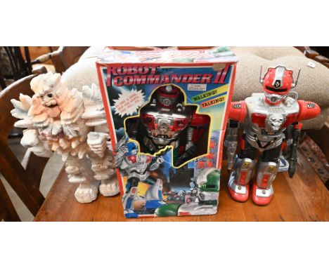 A boxed battery-operated plastic robot, to/w two unboxed robots (3) 