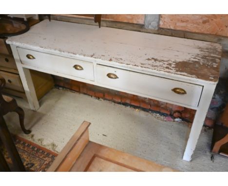 A Victorian white painted (distressed/worn/peeling) pine two drawer wall-mounted side table / console, raised on square secti