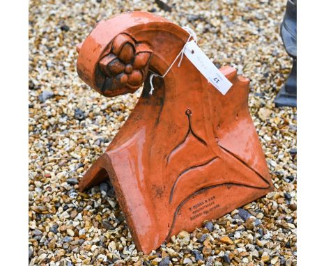 A weathered terracotta roof ridge end finial, 37 x 33 cm 