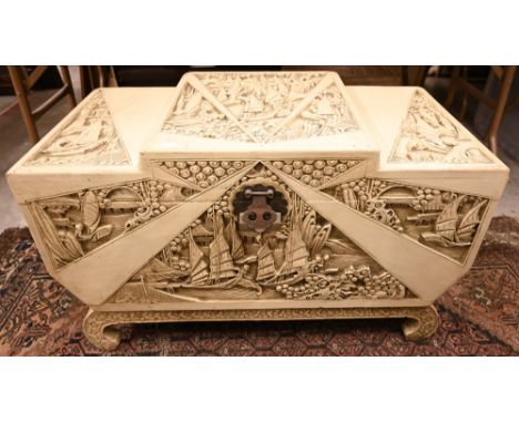 A carved cream painted Chinese step-top coffer with camphor lined interior 