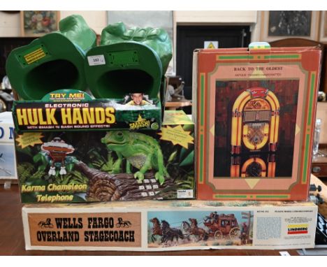 A boxed pair of electronic Hulk Hands to/w a Karma Chameleon automated novelty telephone, novelty juke box radio/cassette pla