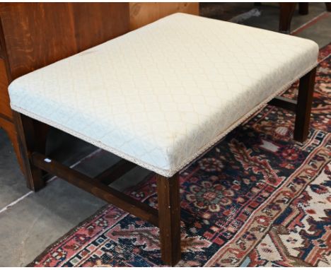 A mahogany framed stool with beige diamond lattice fleur-de-lys upholstery 