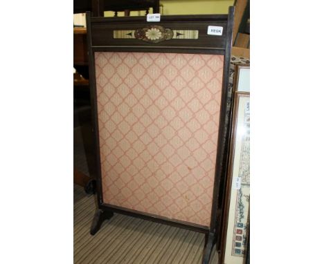 A SMALL TRELLIS PATTERN UPHOLSTERED FREESTANDING FIRESCREEN 
