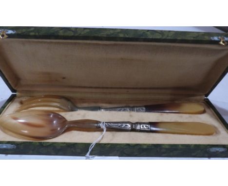 A cased horn and white metal mounted serving spoon and fork