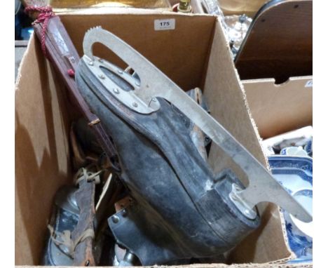 A box of ice skates, sword and tools