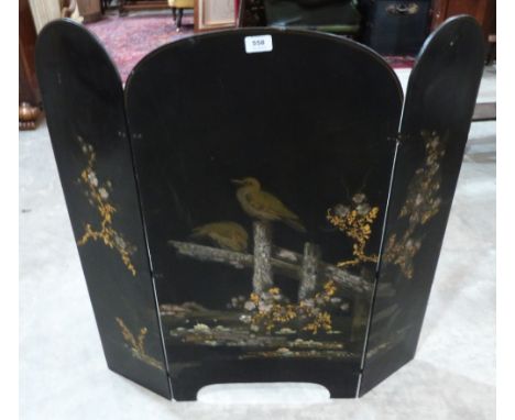 A Japanese black lacquer triptych firescreen, painted with birds and prunus, inlaid with mother-of-pearl and gilded. 32½' hig