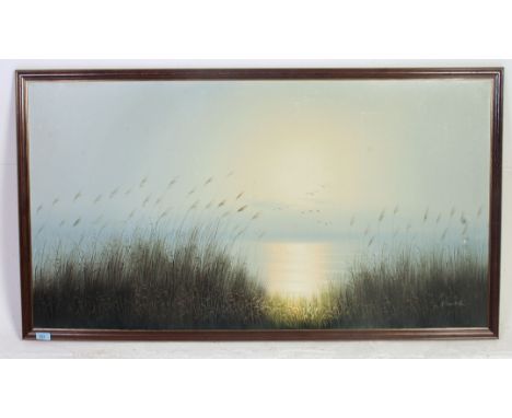 A large framed oil on canvas of Geese in flight over a lake signed to the lower corner K Sander