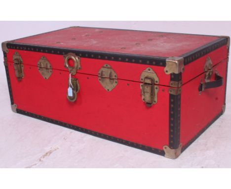 A 20th century retro red and metal strapped steamer trunk case having hinged centre. H35 x W99 x D99 cm 