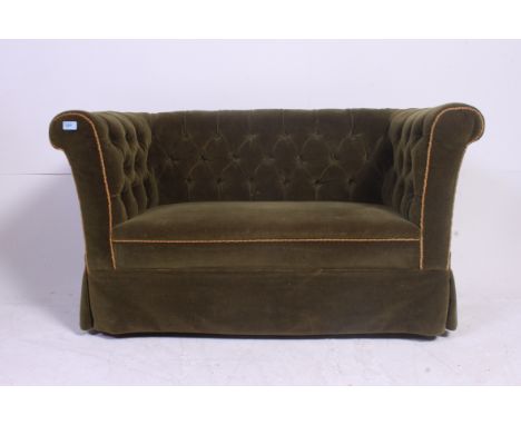 A rare Victorian Childrens sized two seat chesterfield sofa settee. Raised on turned mahogany legs having green velour uphols