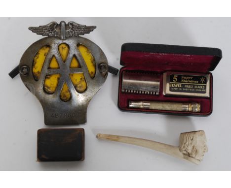A mixed lot to include a clay pipe, snuff pot and vintage AA car badge, along with a vintage cased Gillette razor. 