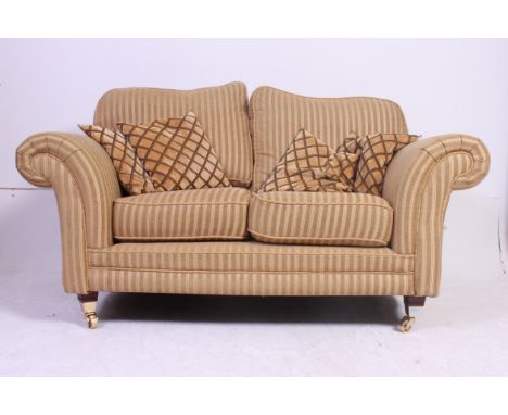 Antique style Kirkdale quality 2 seat sofa settee raised on mahogany tapered legs with brass cap castors upholstered in deep 