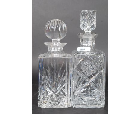 Two vintage cut glass decanters both with stoppers. H38 cm 