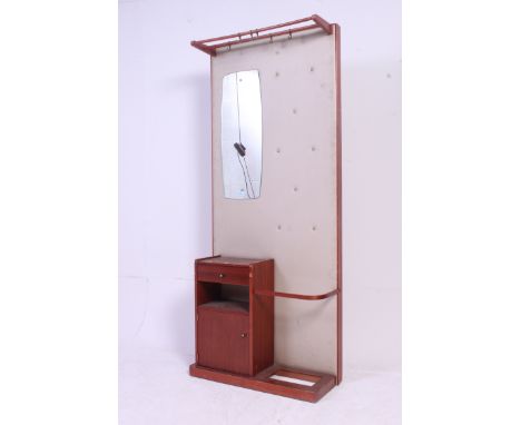 A vintage retro 1970's vinyl upholstered hall stand having miror upright with teak cabinet flanked by a stick stand. Retailer