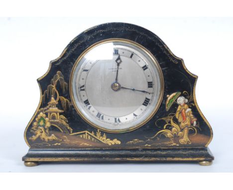 An early 20th century chinoserie decorated lacquered mantle clock, the dial with notation for Fortnum & Masons. 