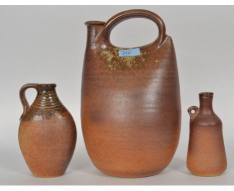 Muchelney studio pottery stoneware handled flagon by John Leach dating from the 20th century. The stoneware flagon is of flat