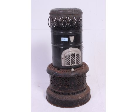 A vintage large enamel Valour greenhouse / garden heater, in typical cast iron construction, in black. H 61 x W 33 cm 