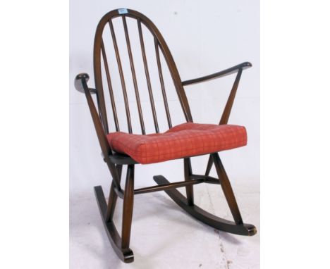 An Ercol golden dawn Windsor pattern stick back rocking chair, stamp to rear. H86 x W62 x D70 cm 