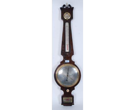A 19th century Bano barometer having mercury back with thermometer. Silvered dials with  dry / damp gauge, Mahogany case with