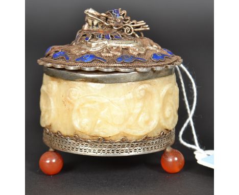 A Chinese silver and silver plated alabaster trinket pot of circular form raised on glass ball feet. THe silver dragon finish