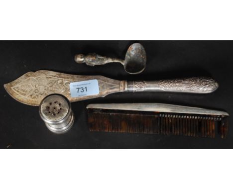 Silver and silver metal items to include a comb holder, serving knife, feeding spoon and a pepper cruet