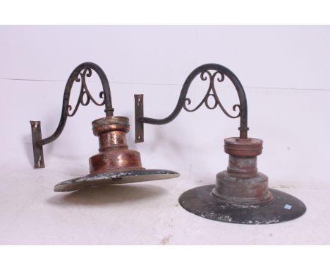 A set of 2 vintage Industrial large Sugg ? Railway Platform Lamps having copper surrounds being set on rococo cast metal arms