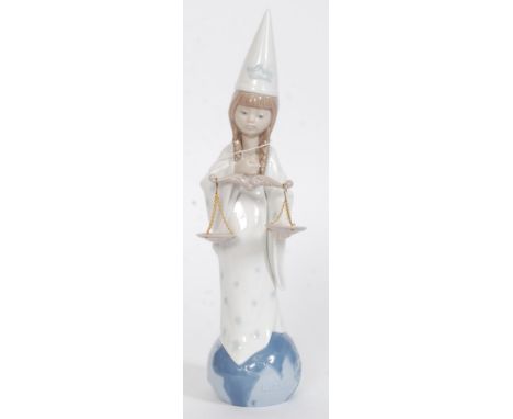 A Lladro Zodiac figurine ' Libra ' Impressed factory marks 6220 to base also bearing  blue stamp to base. Measures 31cms High