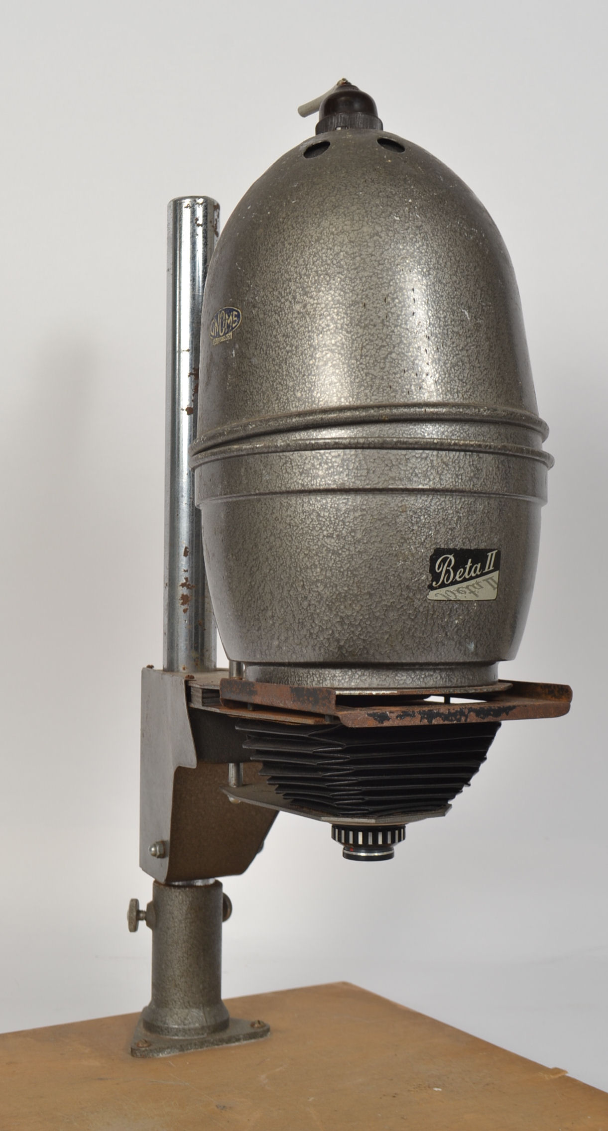 A vintage 1950s Gnome overhead photo enlarger raised on wooden plinth