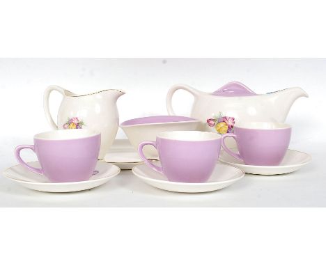 A Bristol Poutney Lilac & Sweet pea retro decorated tea service. Three settings, with teapot, milk jug, sugar bowl and cake p