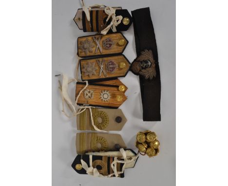 A collection of military shoulder taps and epaulets to include army and navy officers together with an embroidered regimental