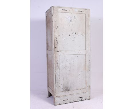 A vintage industrial military painted locker. The upright body with full length door having sectioned interior. H190 x W79 x 