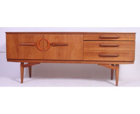 A vintage retro mid 20th century teak wood sideboard having 3 drawers to the right with drop down central cupboard having det