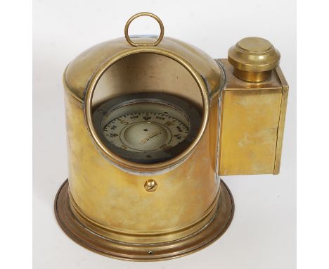 A Sestrel gimbal mounted ships compass, early 20th century, housed within a gilt metal / metal binnacle hood with oil lamp to