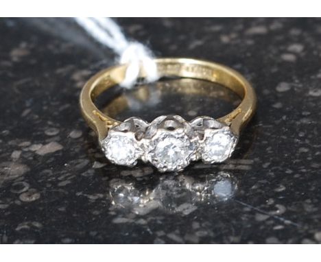 A vintage 18ct gold 3 stone diamond ring. Each diamond bezel mounted approx .10pnts each. Total weight 3.1g. Ring size L