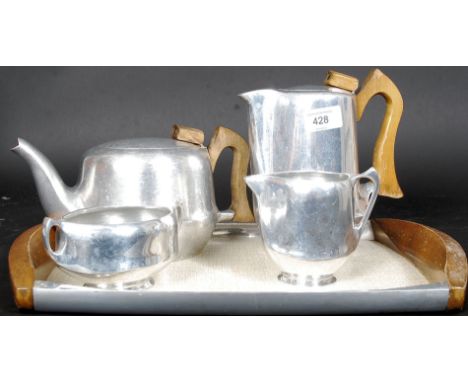 A retro / vintage Piquet Ware tea and coffee service consisting of pots, cremer, sugar bowl and original tray