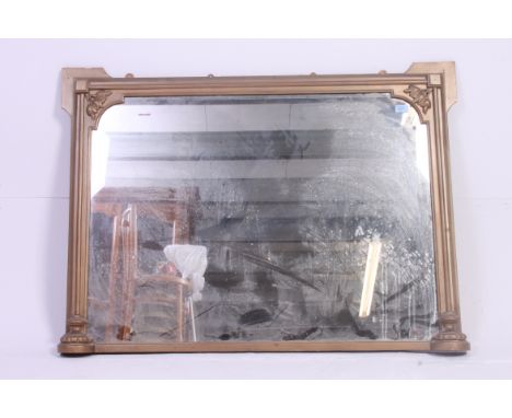 A vintage Gilt overmantel wall mirror having column sided frame with central mirror plate. H 83 x W116 cm 