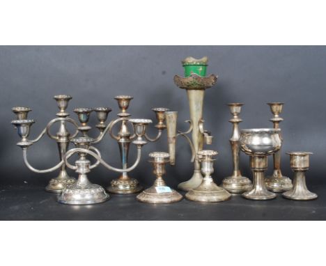 A collection of silver plated candelabras along with a silver plated table epergne. H34cm