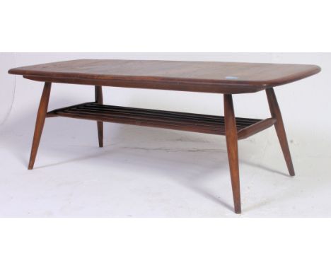 Ercol Golden Dawn elm rectangular coffee table with under-tier, 46cm x 104cm in the Windsor pattern. H37 x W15 x D43 cm 