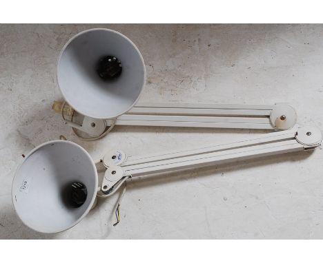 A pair of large contemporary vintage style wall mounted anglepoise lamps by Luxo- both in white