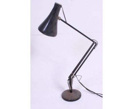 A post war black Herbert Terry Industrial office anglepoise desk lamp raised on circular base with pendant shade. 90 cm Tall.