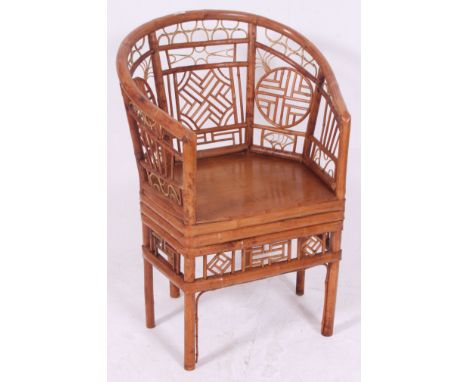 A decorative vintage 'Plantation' cane conservatory chair. H75 x W68 x D47 cm 