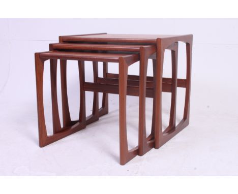 A vintage 1970's G-Plan teak wood nest of tables having graduating tops to each