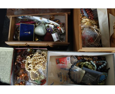 A large amount of assorted costume jewellery to include necklaces, bracelets, rings, cufflinks, tie clips, brooches and many 